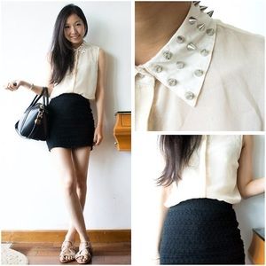 White sleeveless sheer top with studded collar